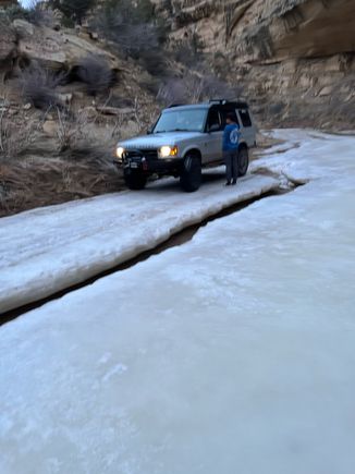 Driving over the frozen creek on the way to camp