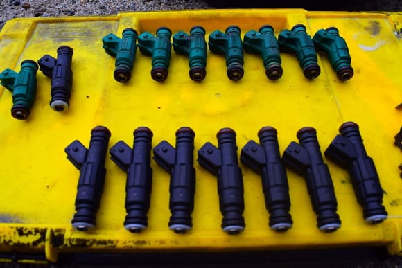 The swap was a no go. The 19Ib injectors are taller than the genuine Bosch injectors.
