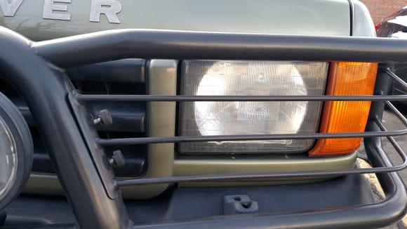 You can see if you unscrew these quick bolts that the headlight guards come off.