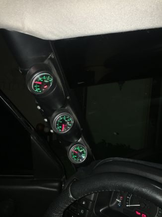 It is hard to get a good picture at night but these are my a-pillar gauges. The oil pressure sender is in the front cover where the oil cooler line would go. I know some people say it isn't as reliable but it has given me good reliable feedback and tells me more than the idiot light on the dash. I would say it saved my motor since it gave me the feedback to shut it down when my cam bearings slipped where the idiot light barely came on.