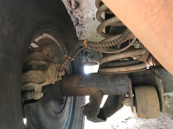 In my research I've seen guys weld the axle bracket outside of the spring here