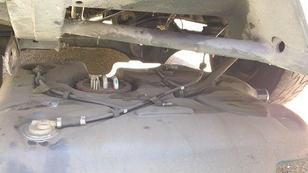 Step 14d Using Helper or a handy jack gently lower the tank from the left