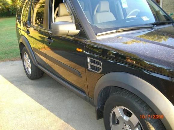 Installing OEM Rubbing Strip (Side-body Molding). Finished passenger side.

This is also a good comparison shot of the before Wheel Spacers.  Compare this to the Passenger Side After Wheel Spacers.