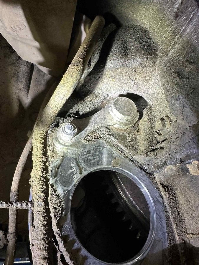 starter removed, fly wheel locking pin installed