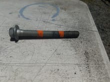 This is one of the shorter outer bolts, the orange line on the left is how long the bolt is when torqued all the way down in the hole. I measured 2.75 inches from the block deck to the bottom of the hole. It was 2.75 inches deep in every single hole, the inner ones and outer. Im kind of confused. Any ideas?