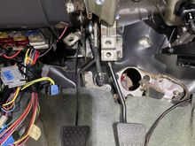 You can see the clutch rod in the center of the picture between the pedals.  It's easy to notice the angle and that it's not perpendicular to the pin on the side of the pedal.