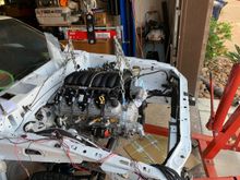 Getting close.  I have to admit that I dabbed just a small amount of grease on both ends of the red, polyurethane motor mounts just to help them slide easily inside the "ears" of the swap brackets.