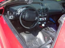mind you this is the interior After i cleaned it up, still looks like shit.

Car had neons, red shift knob and steering wheel cover,alarm and stereo switches, no console lid, no visors, headliner.. ect ect