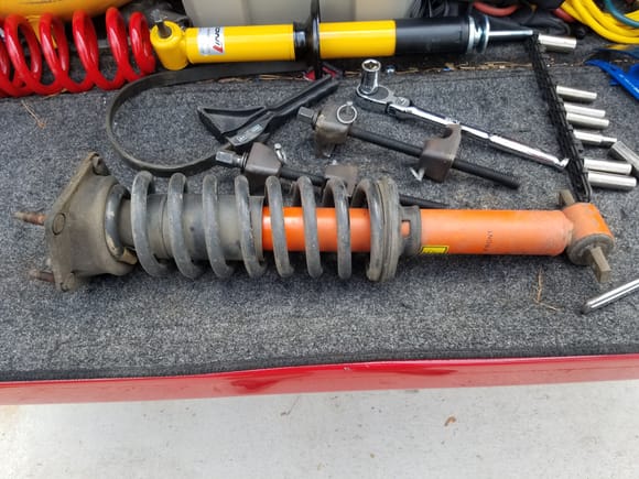 Old shocks were corroded bad. Had to cut the shafts off with my sawzall. Also had to replace upper perches as they were on bad condition. Guess that is what 24 years does to them.