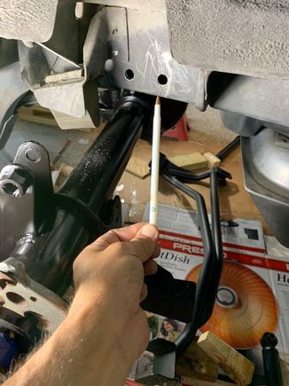 You can see part of the PHB setup on the floor.  My pen is pointing to one of the holes that I had to drill in the "frame" of the car to mount the bar.  The MM instructions are written well and I don't remember having a problem with the install.
