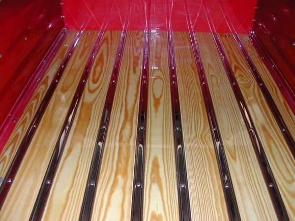 bed finished with 5 coats of automotive clear coat