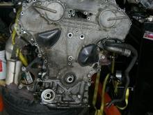 04 engine is in the background on a engine stand.