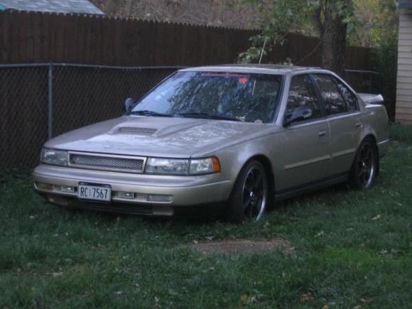after a while i did some changing,like the enkei rims,tokico shocks and eibash springs,hood scoop, BMW headlights and side mirrors,then the trunk from a 04 toyota Solara drift wing.i started this from 05 to 09. There more mods to come in the future i promise.