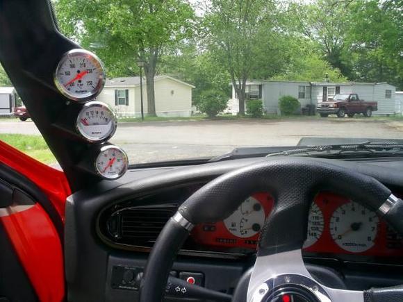 Triple pod with Sun Pro gaugea,Nismo steering wheel i re do the clusters painted a little different.