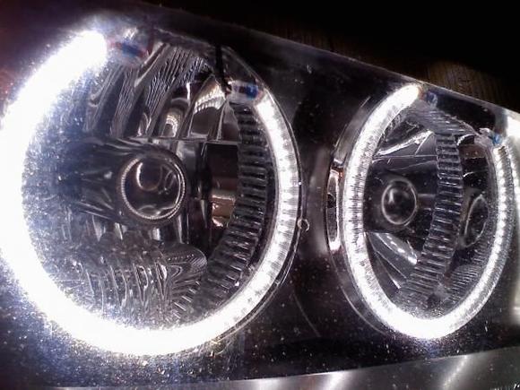 Left ring is fit inside the low beam headlight housing.
Right ring is normal around the outside high beam.