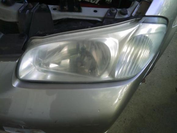 Driver side headlight before using the CV Headlight restoration kit.