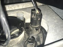 All I want to do is replace the clear marker light that sits next to the amber turn signal indicator in the front bumper. The video guide I found says I can just turn the plug and remove it, but it looks solid and it feels like I’m going to snap some plastic before I get it loose by turning it. I did pull the end of the plug off, but I think that just left the rest of the plug and the bulb in the socket. 
This is very hard for me to get to with my hand, but I’d like some reassurance before I us