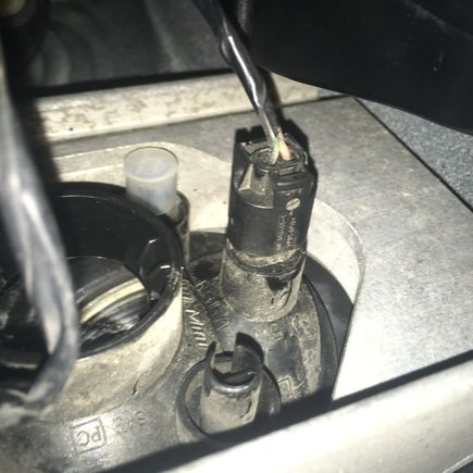 All I want to do is replace the clear marker light that sits next to the amber turn signal indicator in the front bumper. The video guide I found says I can just turn the plug and remove it, but it looks solid and it feels like I’m going to snap some plastic before I get it loose by turning it. I did pull the end of the plug off, but I think that just left the rest of the plug and the bulb in the socket. 
This is very hard for me to get to with my hand, but I’d like some reassurance before I us