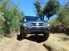 Completely stock, handling a Jeep trail just fine.