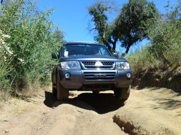 Completely stock, handling a Jeep trail just fine.
