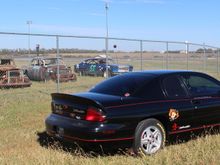 Old Race Cars behind the fence