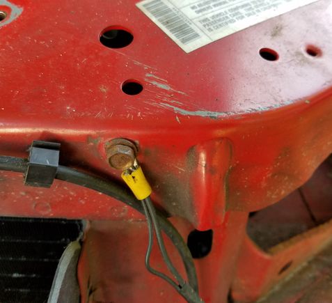 Here it is, right next to the drivers side headlight. My headlight is already out but no need to remove anything to fix the connection.