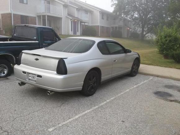 rear/side view with blacked out rims, tail lights, backup lights, third brake light