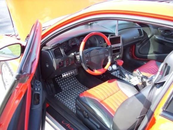 This years interior shot. Fiberglassed new center counsol, diamond plate flooring, gauges and CO2 bottle   switches.