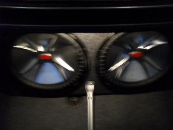 Blurry pic of my old school 15" subs. Yes... That is a crutch that was modified to hold the box in place.