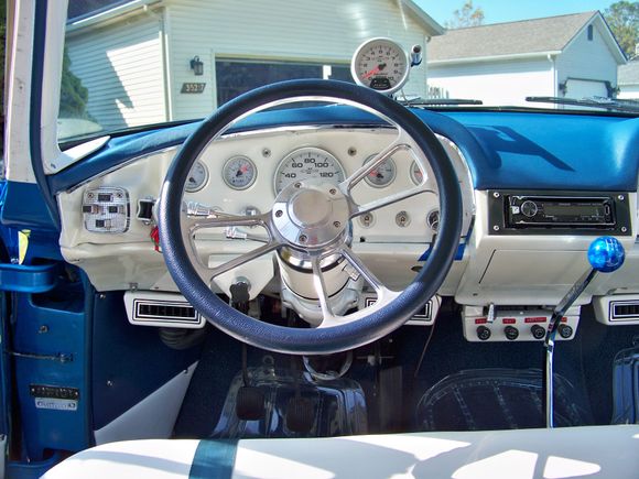 All stock dash with new Auto Meter gauges, note the ac, and the shifter connected to a '99 Ram Viper 6 sd. Tremec. I left the push buttons in 'cause I couldn't figure out how to fill the hole.