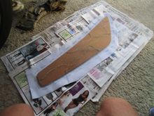 Masonite glued to new vinyl with border lines showing 