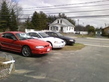 My old 1998 mustang (black) in the back. my buddys '95 (red) in front, and his brothers '02 (white) in the middle