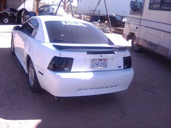 Custom smoked tail lights, side reflectors and 3rd brake light. 3rd brake light was in bad shape before. Also added a stock black spoiler