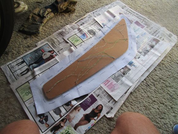 Masonite glued to new vinyl with border lines showing 