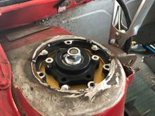 I have chopped off the new top mounts and re-welded them under the strut top.