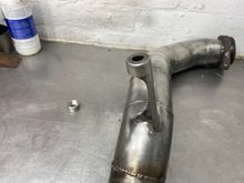 This bracket bolts to the gearbox. 