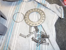Retainer plate, circlip, and springs.