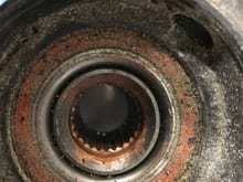 This is a C4 front hub mounted into the bearing and upright. You can see that the end of the C4 hub is conical which mates to the ABS tone ring and shaft assembly. 