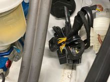 This is the bunch of wires. Based on proximity to master cylinder I'm hoping these are what I need to connect to the Motec. Also in the pic is the red cap for plugging in the sensor. 