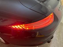 Drivers side clear tail light, on. 