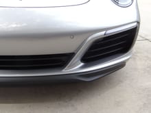 the front spoiler is 2 pieces and a small center relief piece above the front lip
