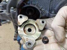 The IMS flange. On new bearings, the date code (G2 here) should match that on the should bolt (H2 below). Mine obviously don't.