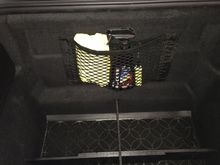 Wanted a way to carry some detail supplies without taking up precious cargo space. Picked up this $14 Velcro Cargo Net off Amazon. It's a perfect fit for our Frunk & looks stock. Velcro holds well, items secure & takes up little space. Easy to tear off if needed. Yes!!!