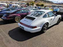 Nice cross section of 964s in the 964 Corral at Rennsport Reunion VI.  Day 3 I was lucky enough to park next to Darin Fister's recent Rudy purchase, beautiful Amethyst C2 --- just the night before he had debuted the brand new FD Motorsport version of the sport exhaust for the 964 --- awesome sound.  Very similar to the Fister Stage IIIs for the 993.