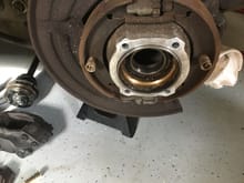 Rotors, calipers, hub halves removed to expose bad bearing