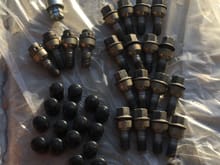 OEM Lug Nuts w/Locks and Key. W/ Black Aftermarket covers if you want them.