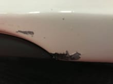 3/4" scratch bottom of Driver front lip that is not visible unless you couch down...