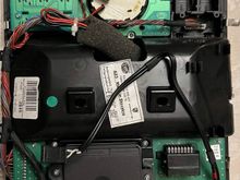 The microphone's wire is the one with small red tape around it in the lower right corner