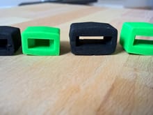 Green 3D printed dampers vs black OE dampers.  Same size, different firmness.