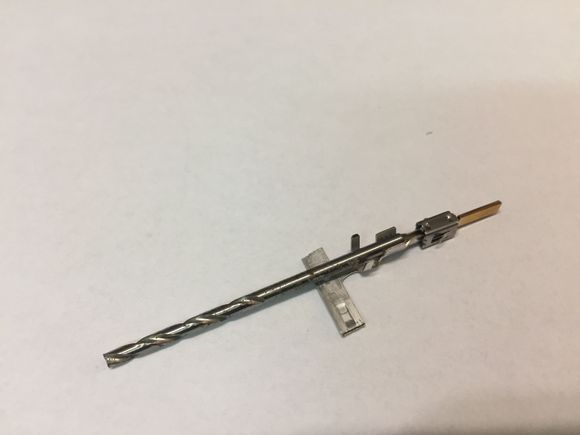 Drill bit for pre-forming tab to accept wire.